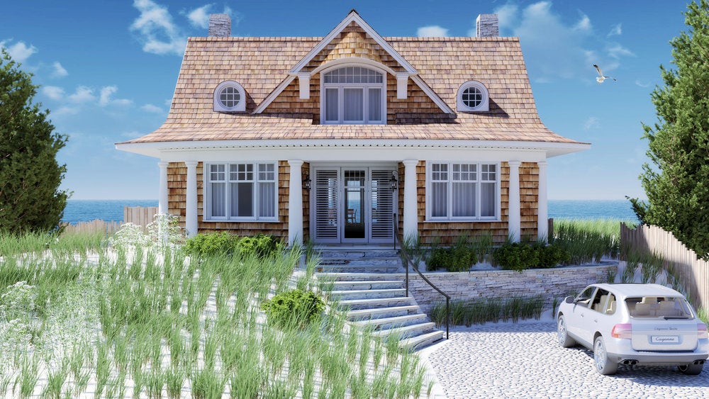 A wood-paneled home in front of the ocean